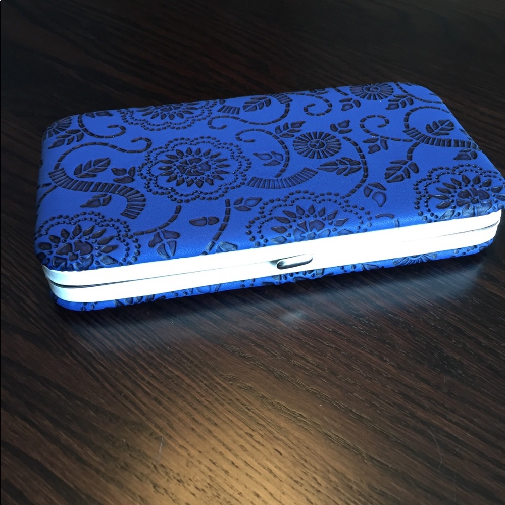 Faux leather wristlet, wallet. Floral embossed